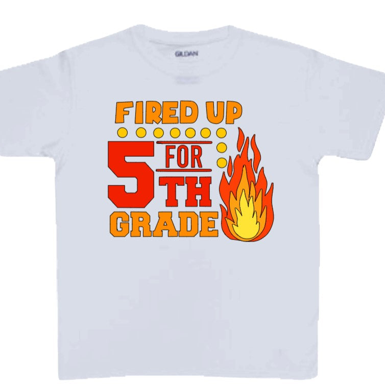 White t-shirt with 'Fired Up 5th Grade' text and flame graphic on a white background