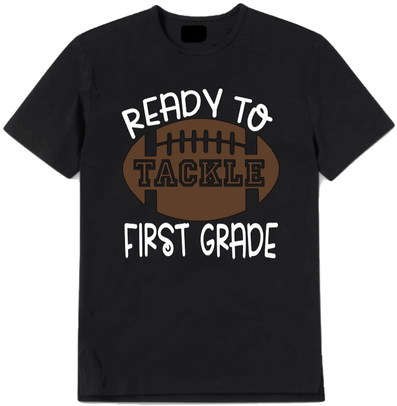 Black t-shirt with 'Ready to Tackle First Grade' text and football graphic on a white background