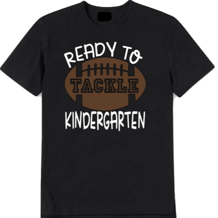 Black t-shirt with 'Ready to Tackle Kindergarten' text and football graphic on a white background