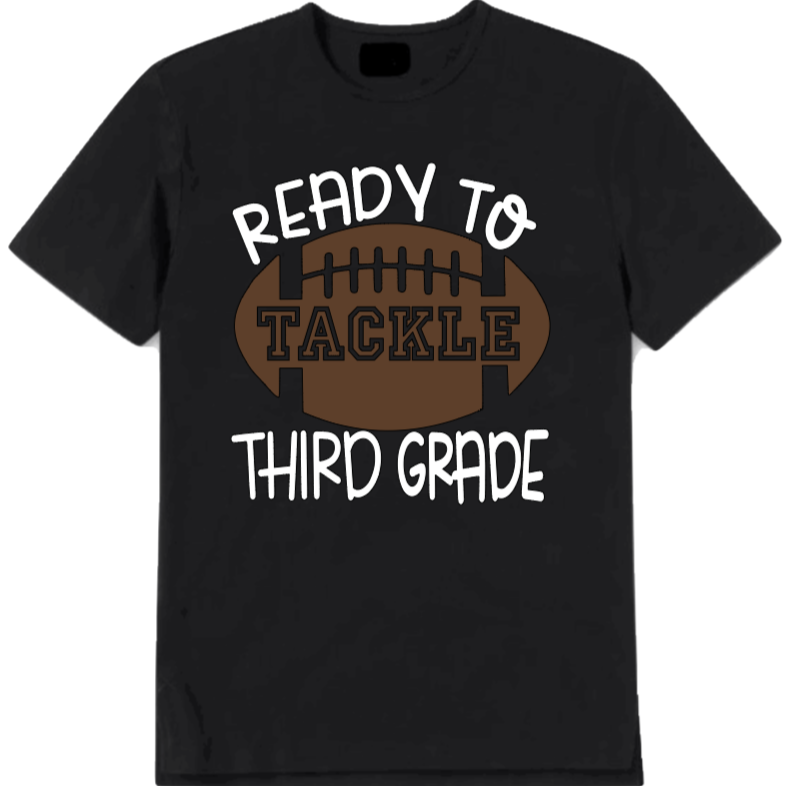 Black t-shirt with 'Ready to Tackle Third Grade' text and football graphic on a white background